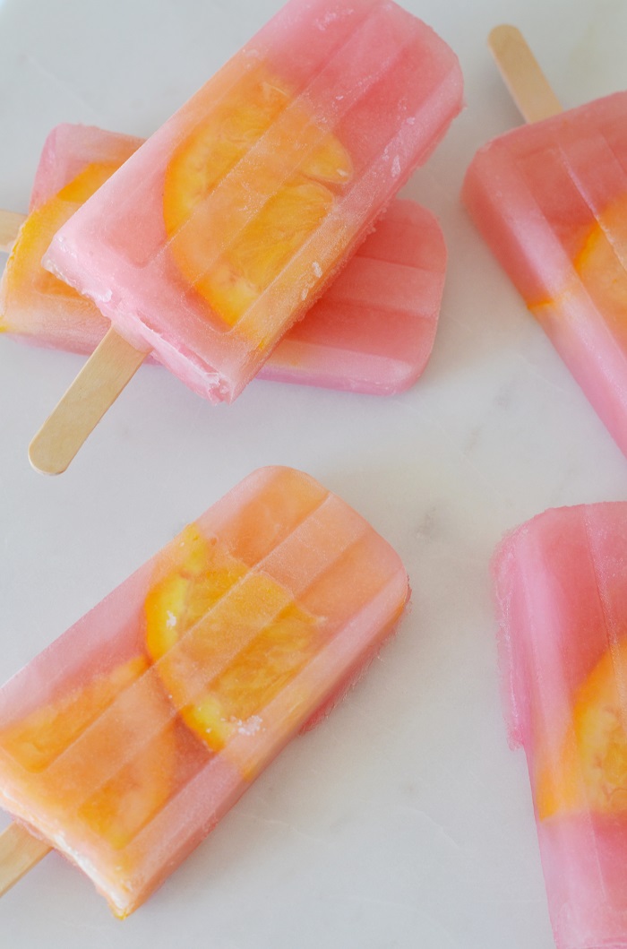 Desiree Leone of Beautifully Seaside features the most delicious pink lemonade popsicles to make for your family.