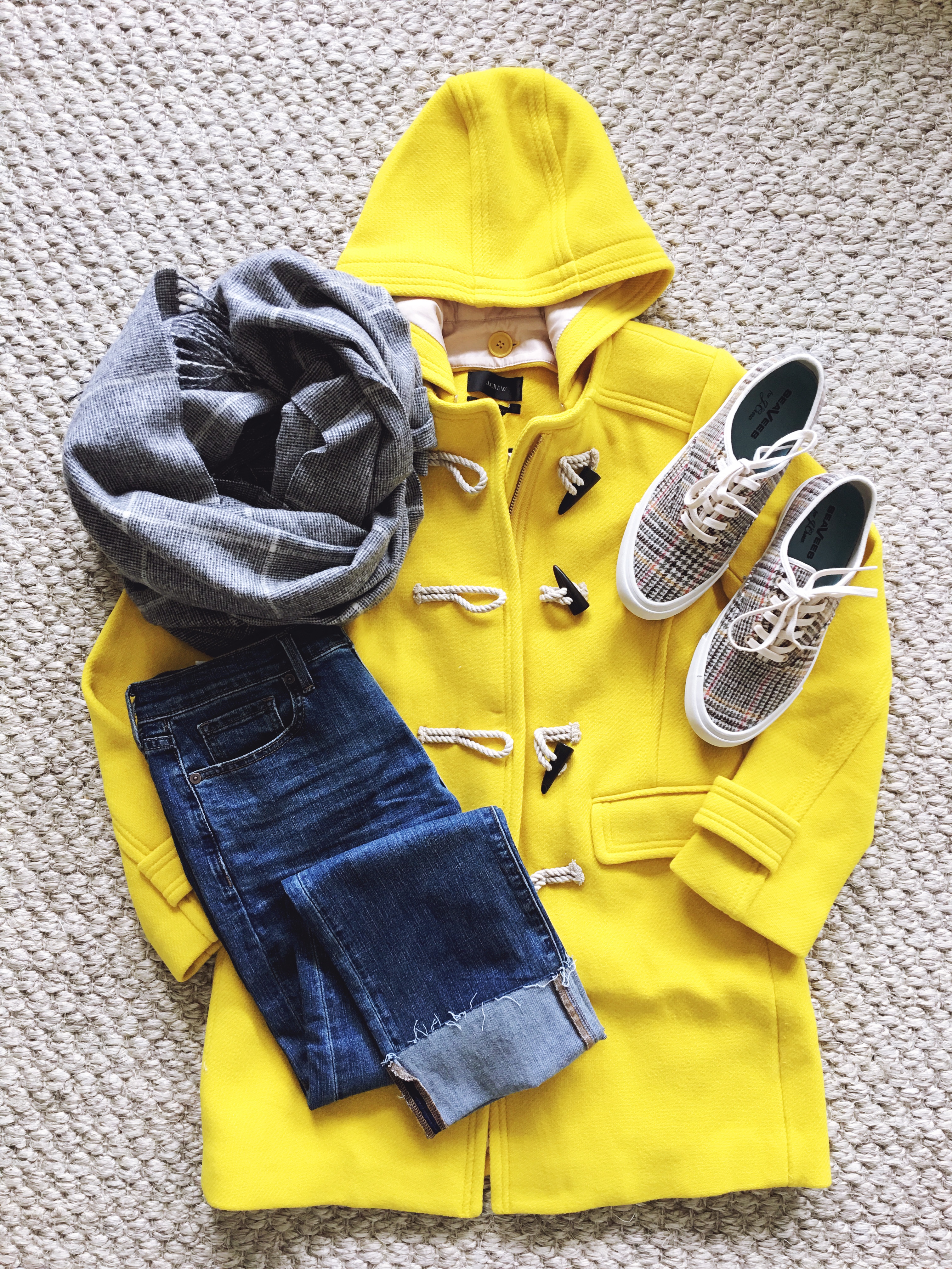 Beautifully Seaside fall outfit flatlay, J.Crew yellow toggle coat, girlfriend jeans, check cape scarf, J.Crew vintage plaid SeaVees