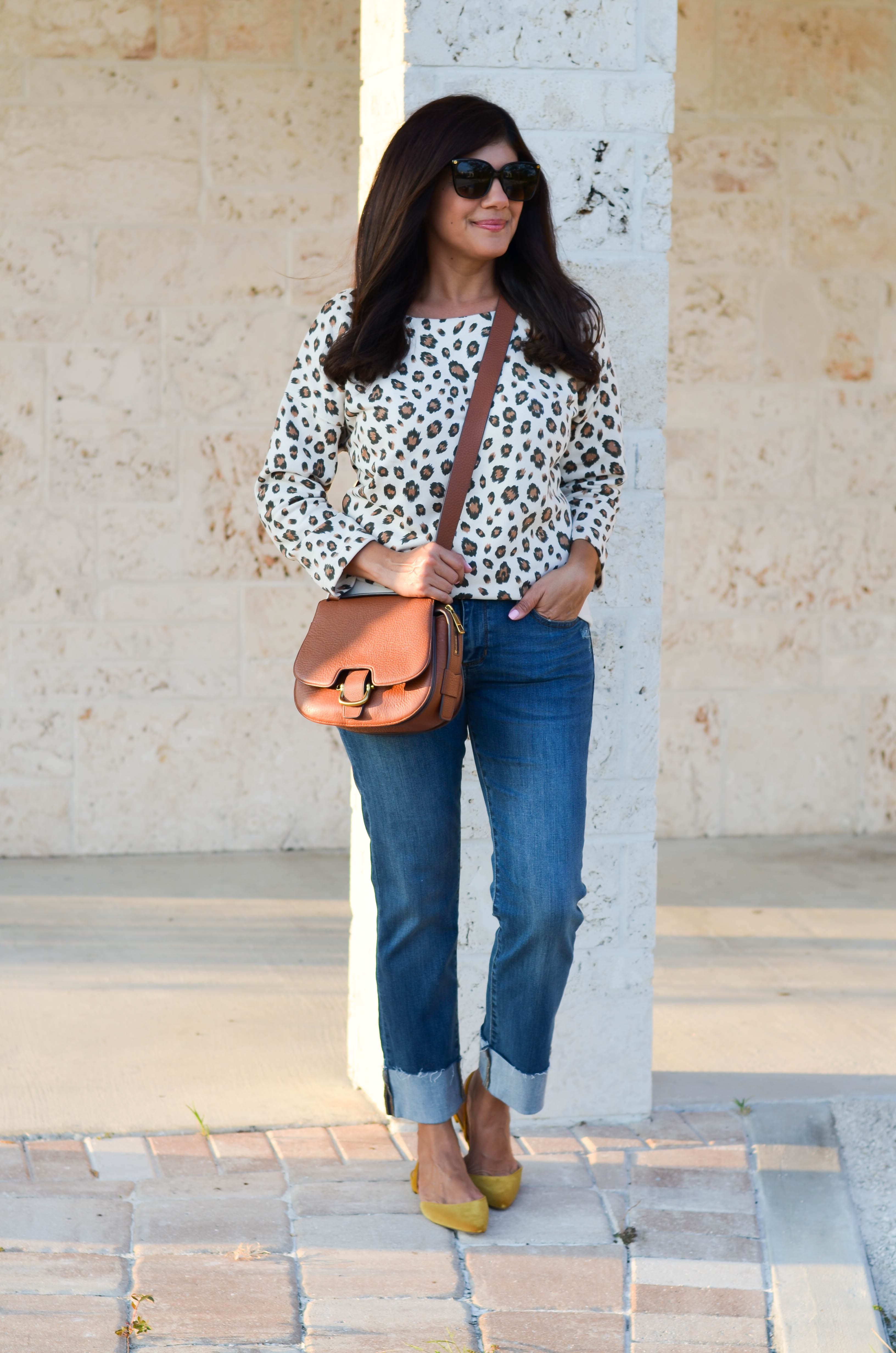 Lifestyle blogger, Desiree of Beautifully Seaside, styles a comfy fall leopard sweatshirt from J.Crew.