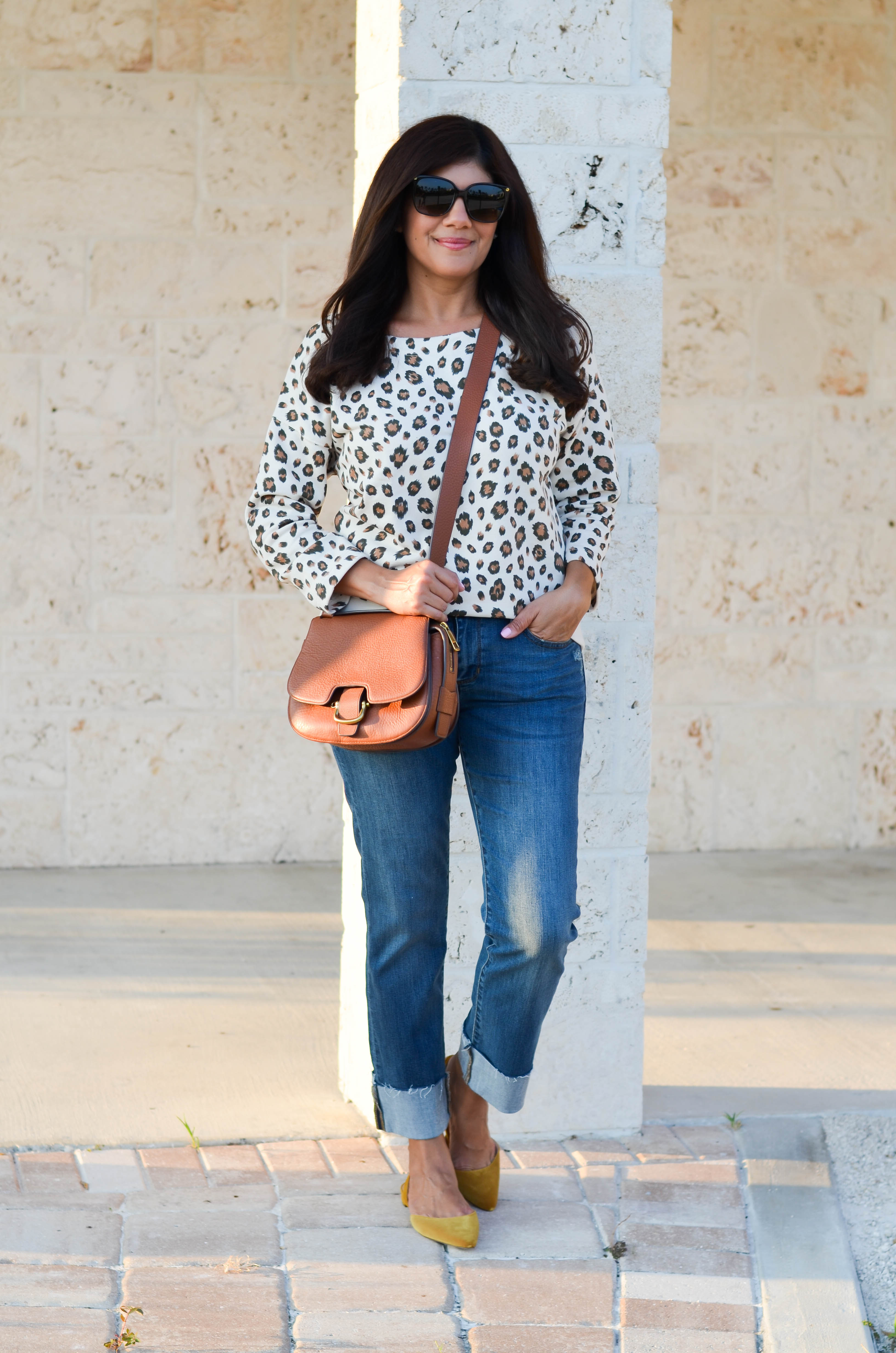 Lifestyle blogger, Desiree of Beautifully Seaside, styles a comfy fall leopard sweatshirt from J.Crew.