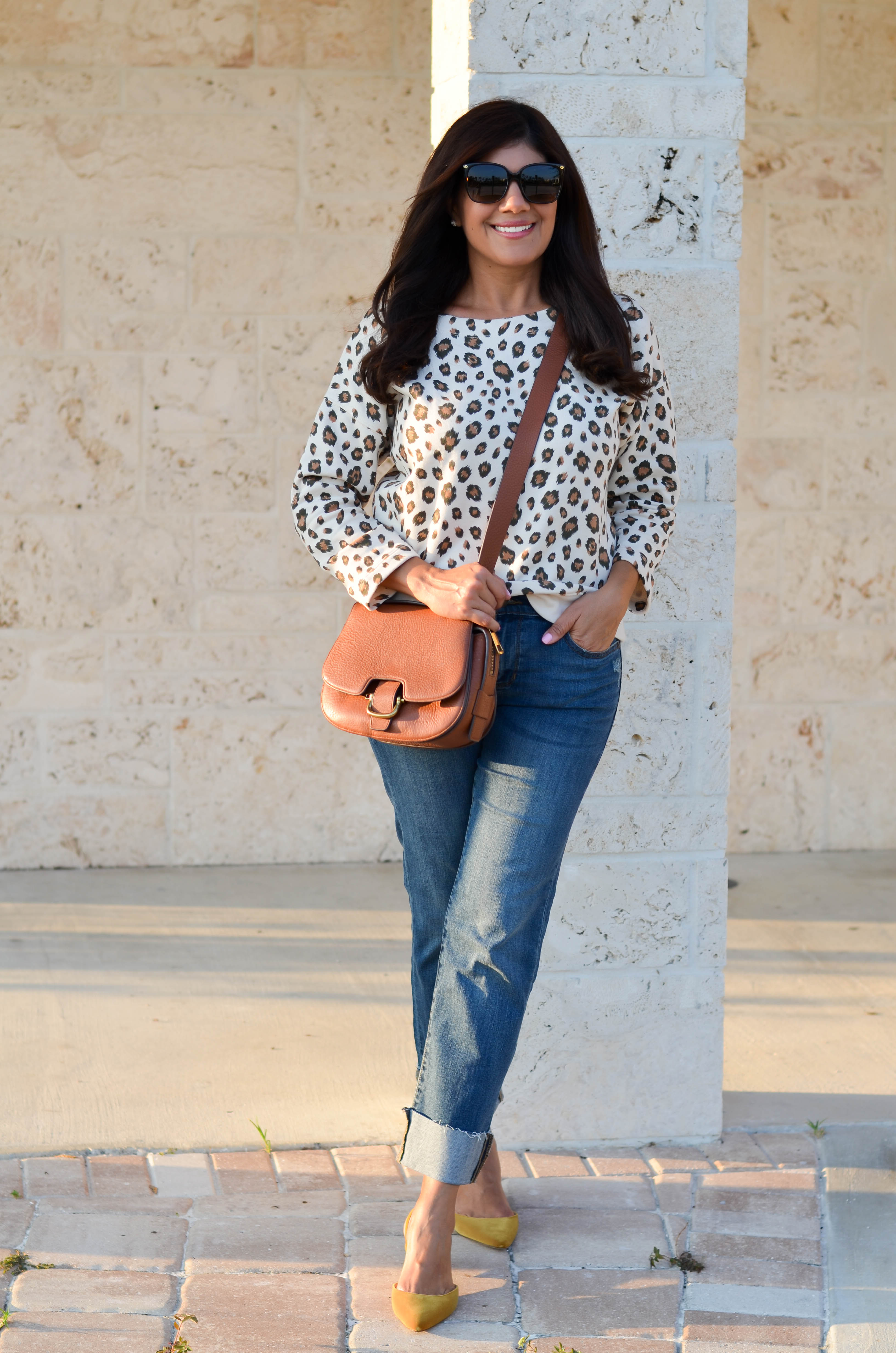 Lifestyle blogger, Desiree of Beautifully Seaside, styles a comfy fall leopard sweatshirt from J.Crew.