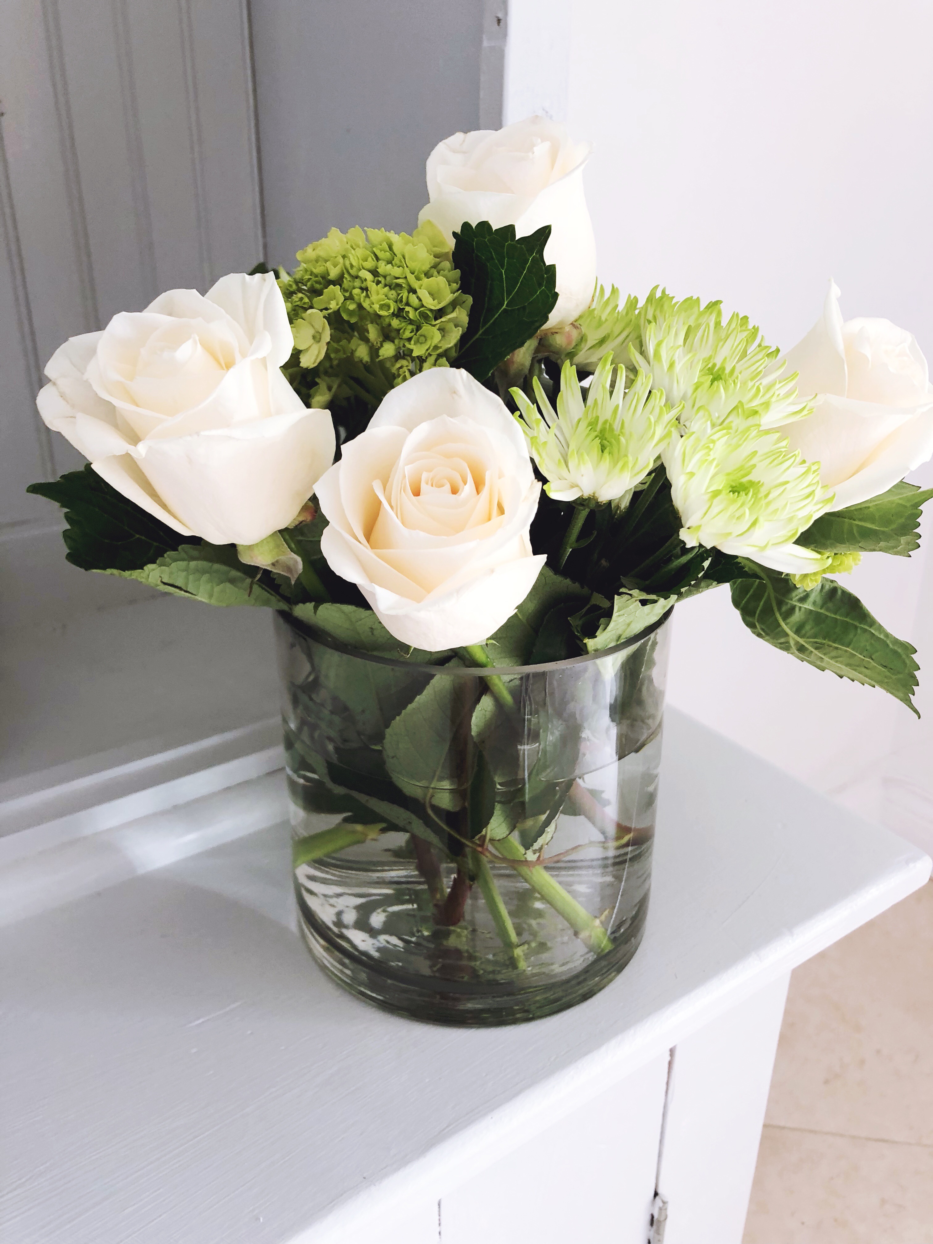 a vase of flowers that shows off the summer paint project