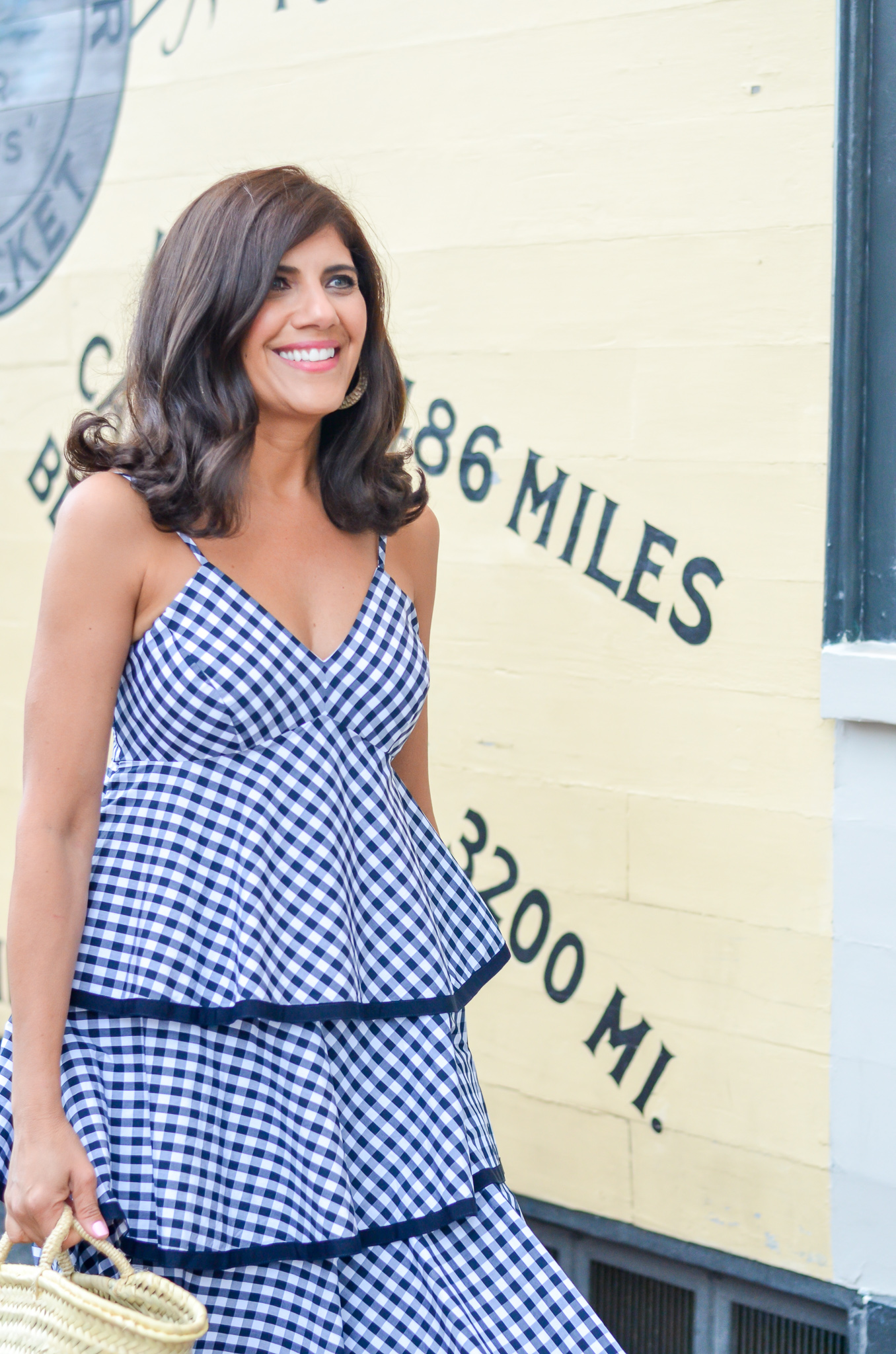 Desiree Leone of Beautifully Seaside wearing J.Crew tiered gingham dress in Nantucket.