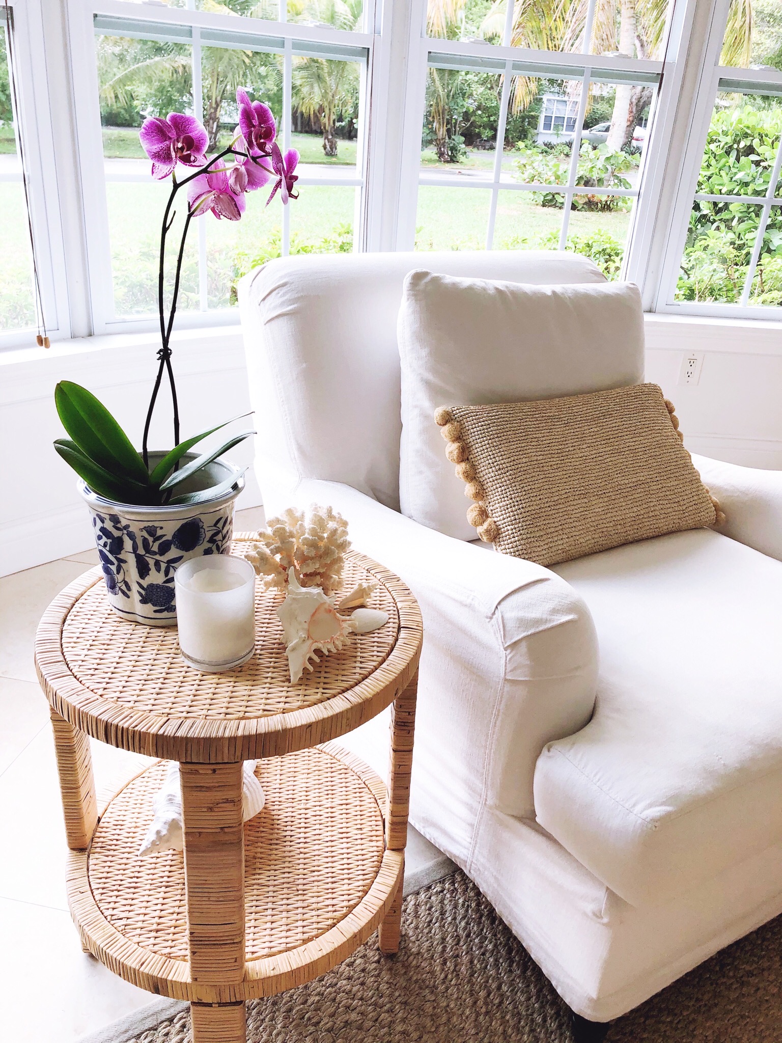 MAY FAVORITES- white slipcover sofa and rattan side table