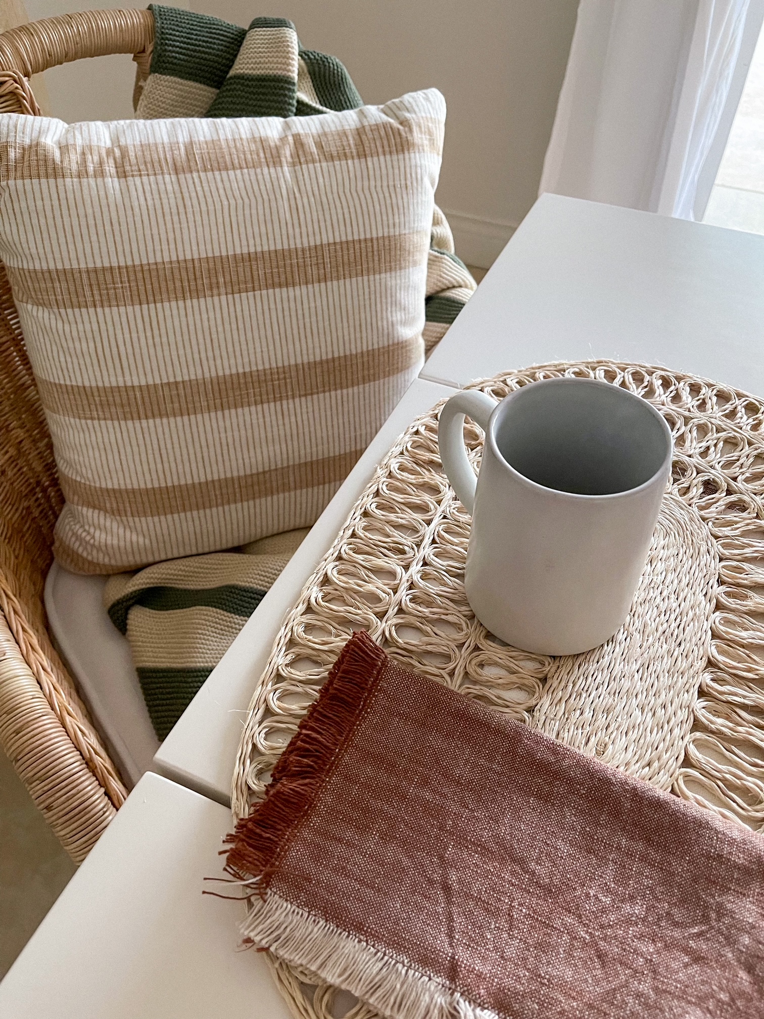 Desiree Leone of Beautifully Seaside shares a cozy fall striped throw and pillow from Target. 