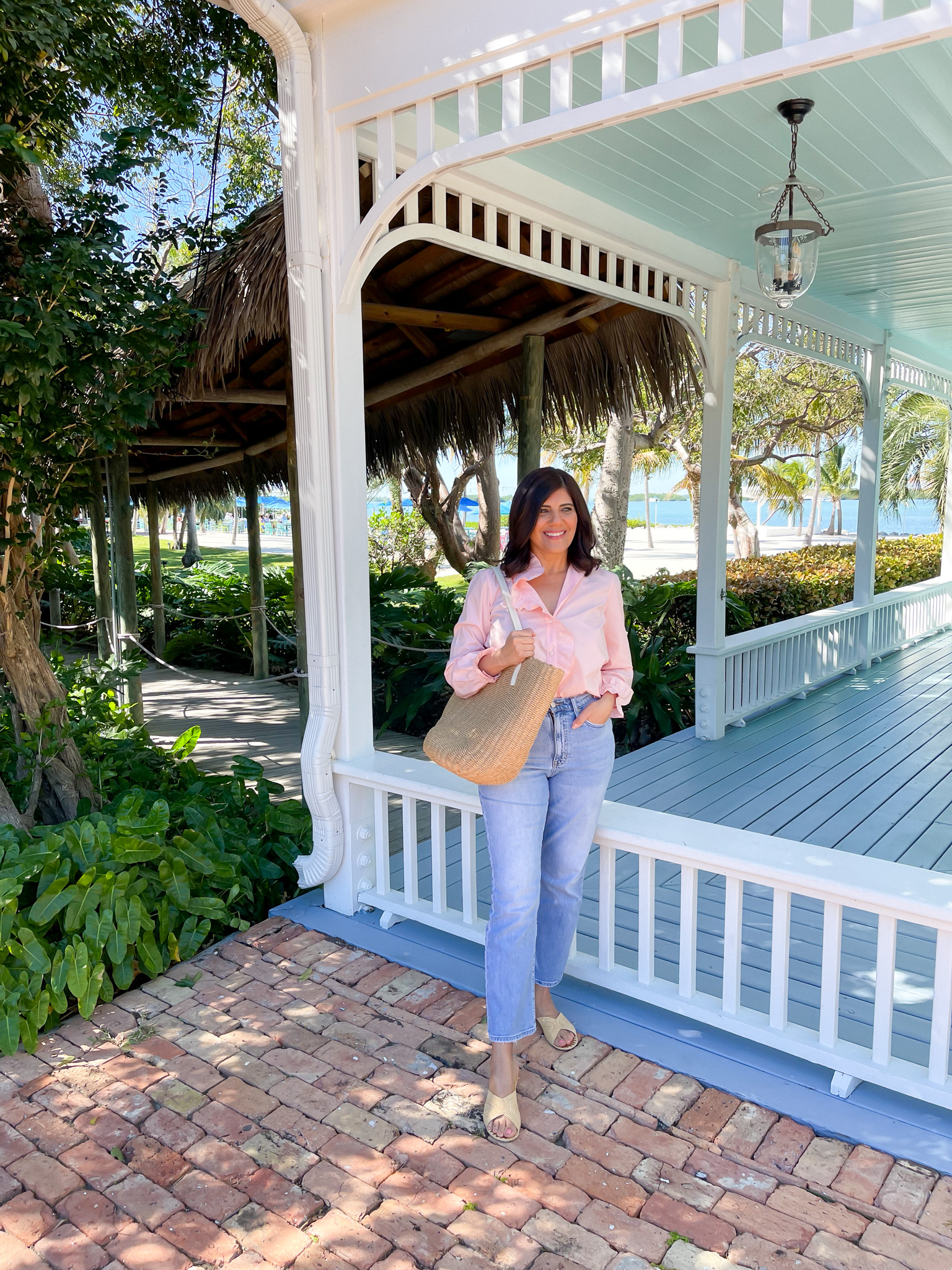 Desiree Leone of Beautifully Seaside is wearing the J.Crew cottage top. A frilly, button-up top that's perfect for wear with jeans. 