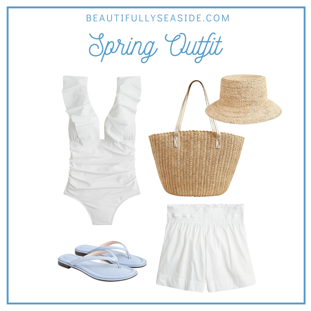 A J.Crew spring outfit featuring an all white beach day look; white ruffle one-piece, white smocked beach shorts, raffia bucket hat, woven straw market tote, blue flip flips. 