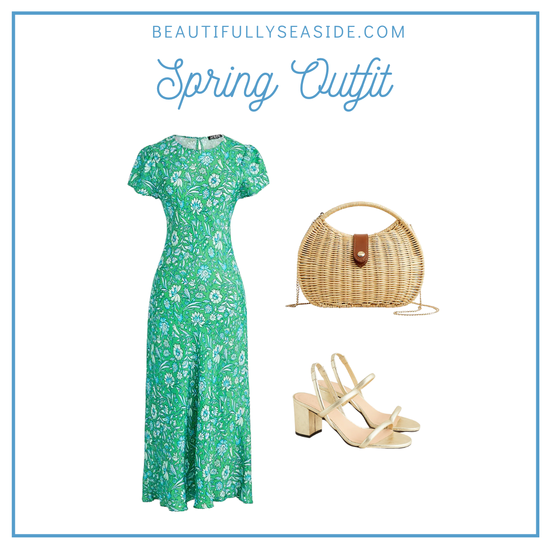 A J.Crew spring outfit featuring a bold print green floral dress, semi-circle rattan clutch, heeled sandals.