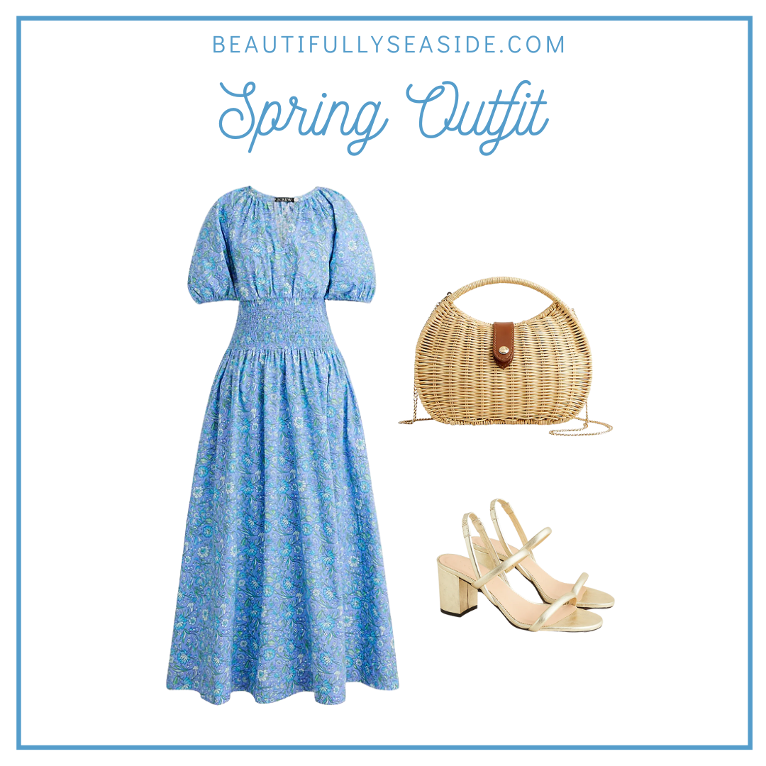 A J.Crew spring outfit featuring a smocked blue floral dress, semi-circle rattan clutch, and gold heeled sandals. 