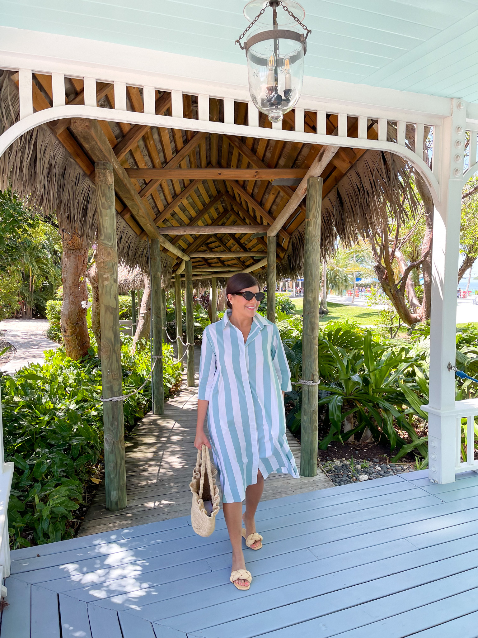 Desiree Leone of Beautifully Seaside wearing a LAKE caftan in bold stripes for spring in Islamorada