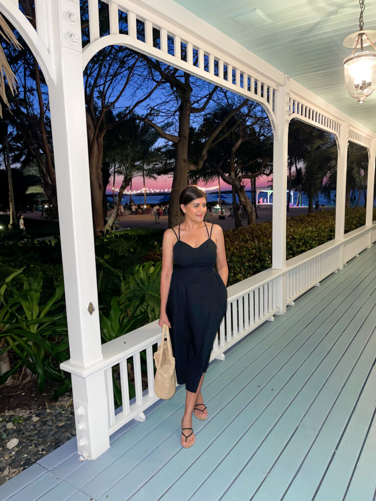 Desiree Leone of Beautifully Seaside wearing a black vacation dress by Target.