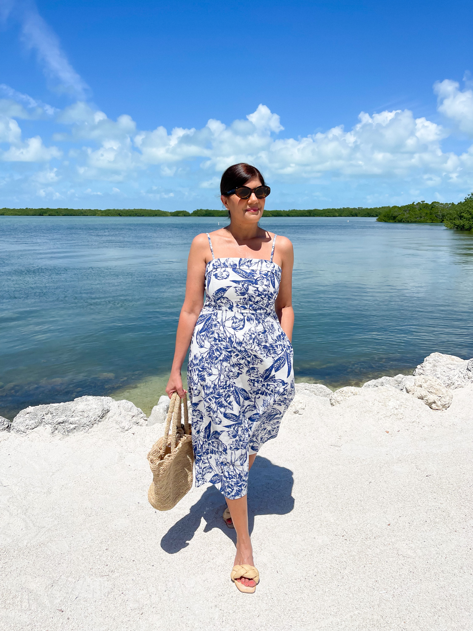 Desiree Leone of Beautifully Seaside wearing an Abercrombie Floral Midi Dress for spring