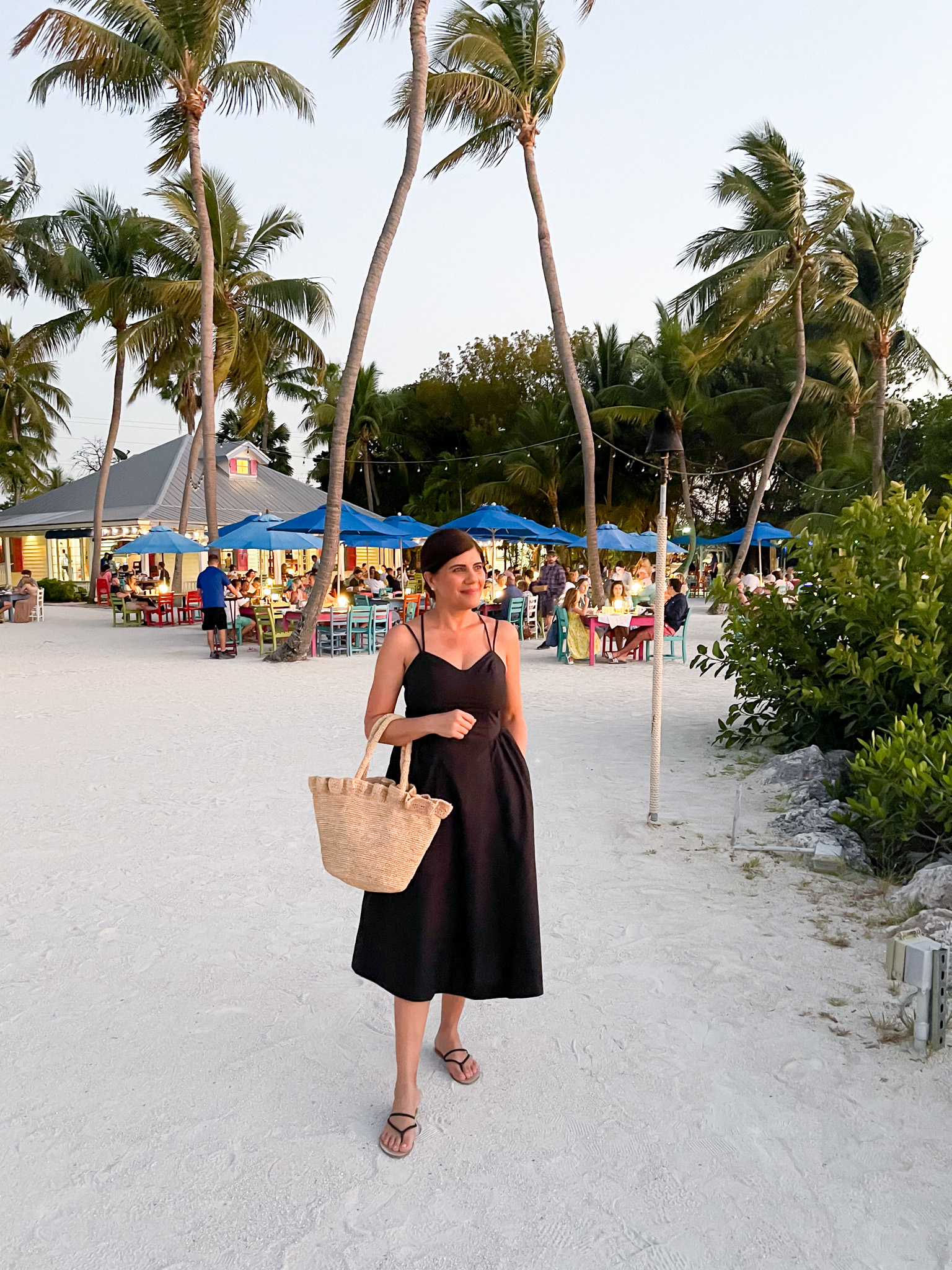 Desiree Leone of Beautifully Seaside wearing a black vacation dress by Target.