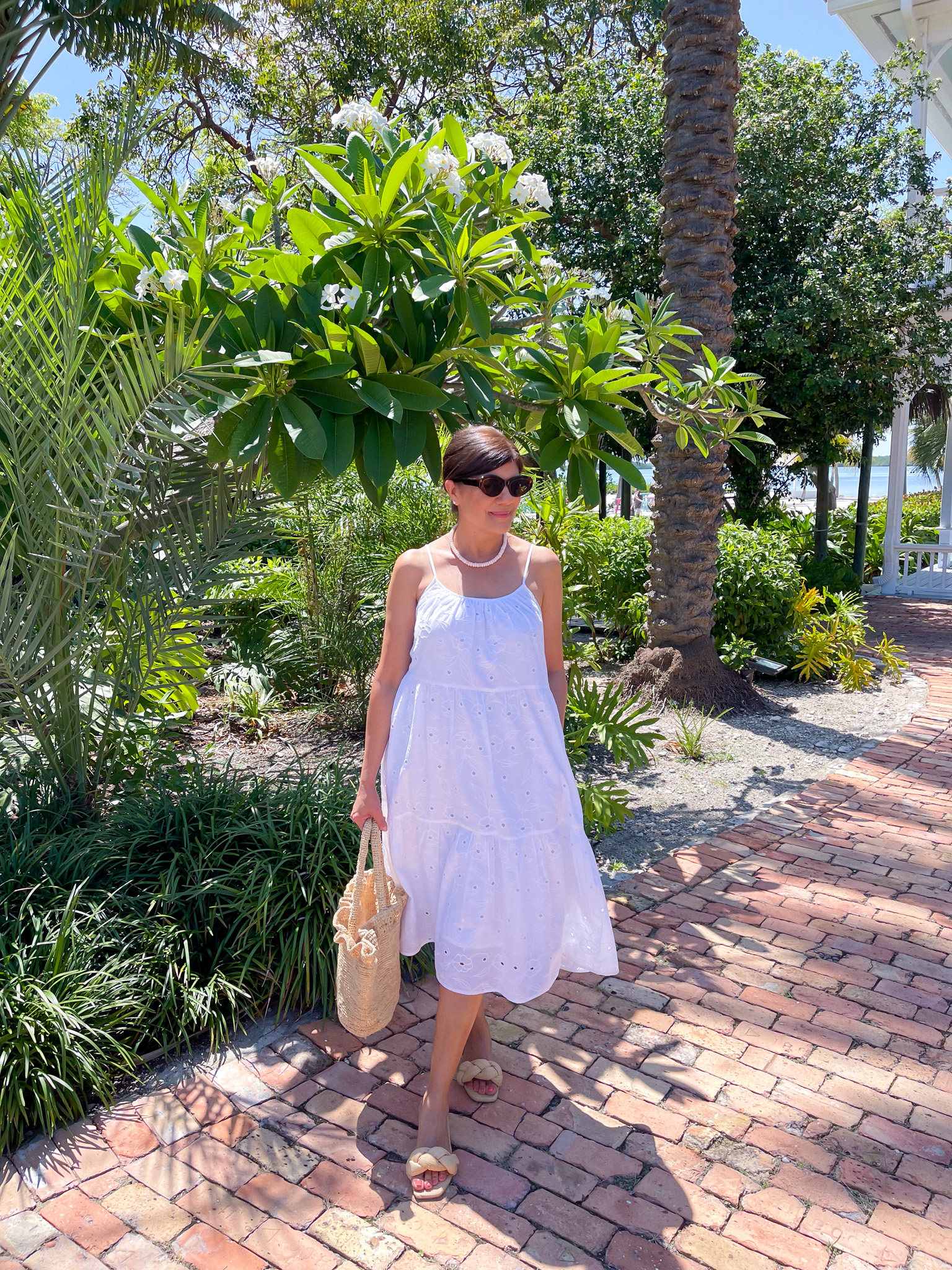 Desiree Leone of Beautifully Seaside features the prettiest breezy summer dresses that you can wear all season long, including this eyelet white dress from Target.