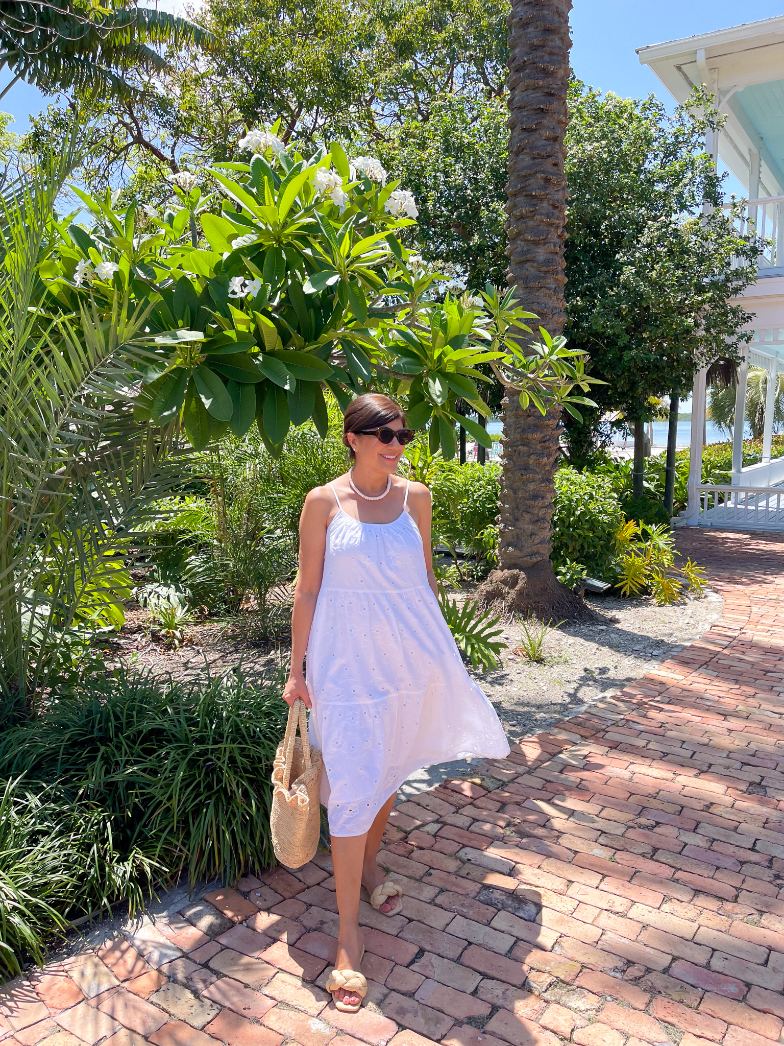 Desiree Leone of Beautifully Seaside features the prettiest breezy summer dresses that you can wear all season long, including this eyelet white dress from Target.