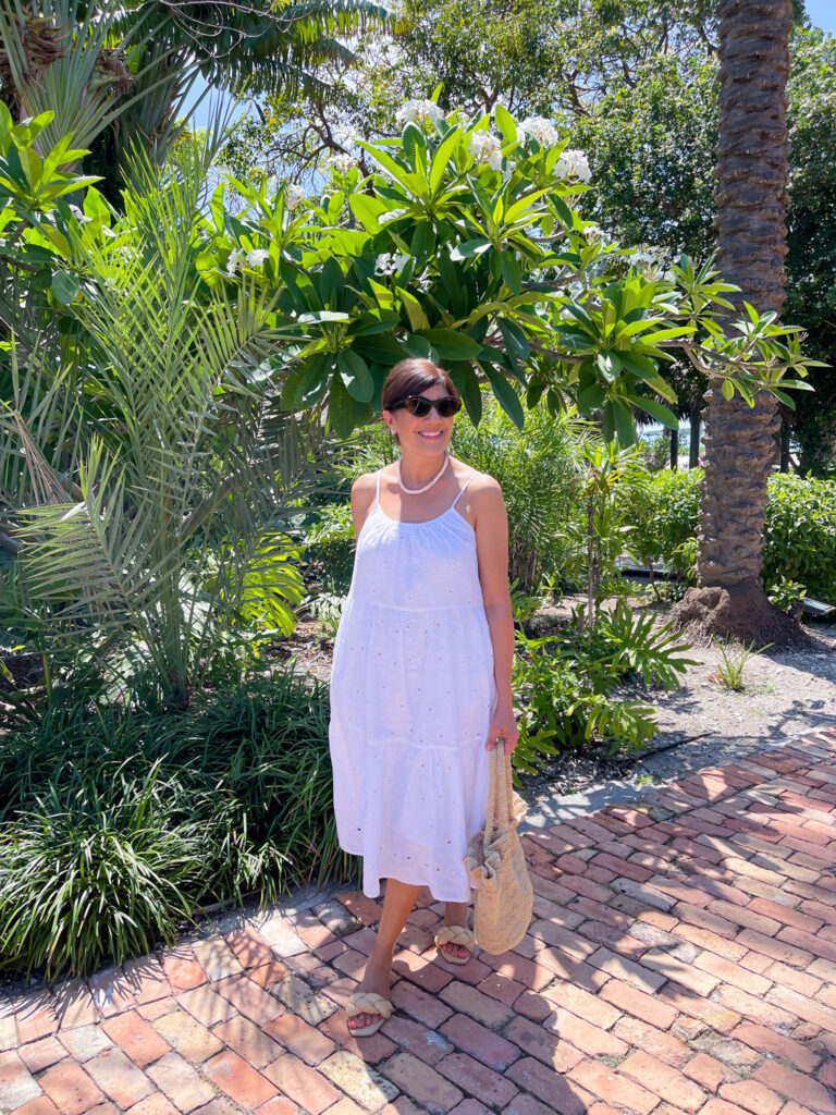 Desiree Leone of Beautifully Seaside features the prettiest breezy summer dresses that you can wear all season long, including this eyelet white dress from Target.