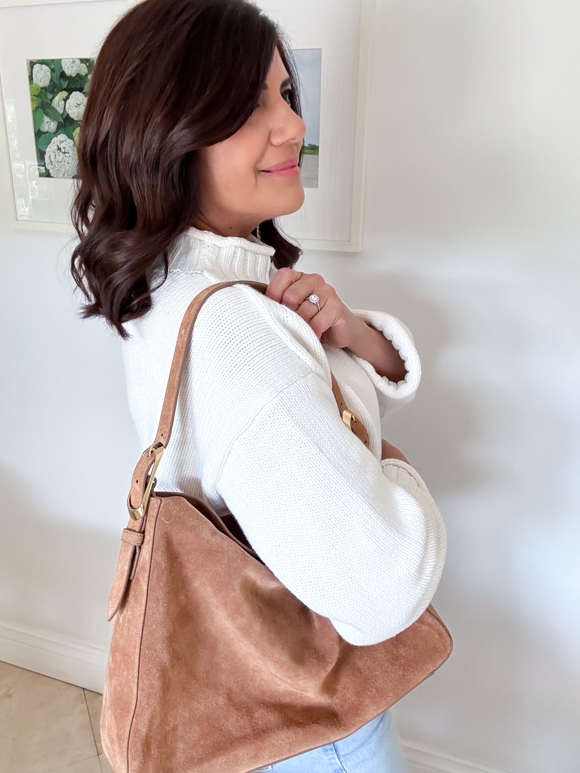 The iconic J.Crew rollneck sweater Is back for 2025—here’s how I styled it, including the best jeans, woven ballet flats, and suede bag.